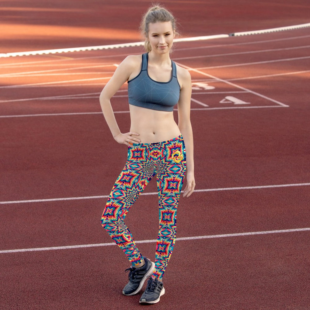Custom all over print leggings with a star optical illusion pattern, worn on a running track