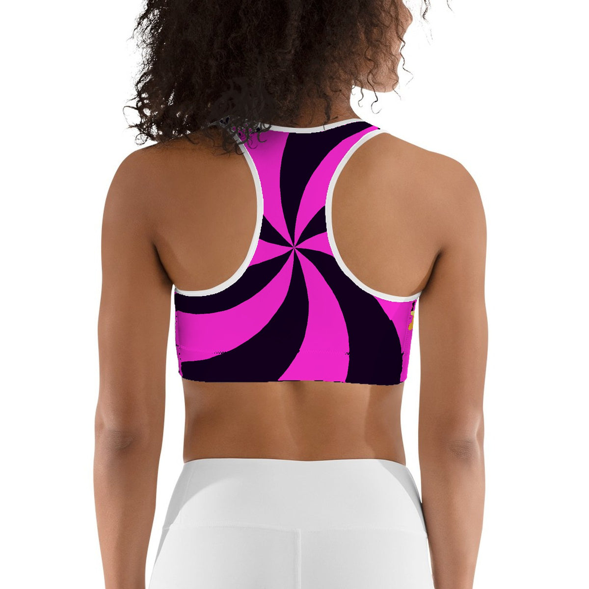 Custom all over print sports bra with a magenta pinwheel, back view